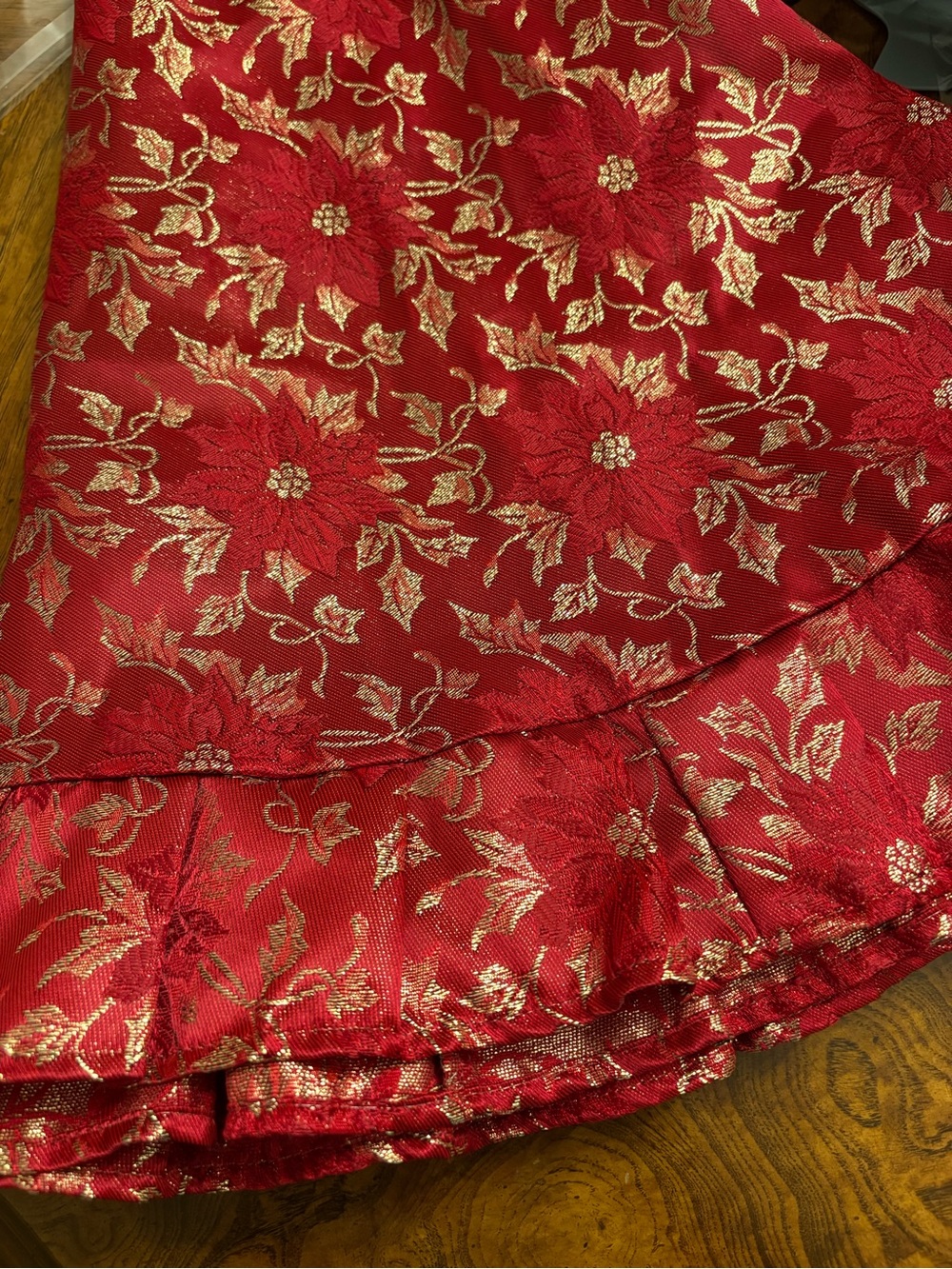 Red & Gold Christmas Tree Skirt. No flaws or stains that I see. It’s beautiful.